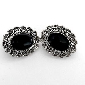 Vintage Sterling Silver Oval Clip-On Earrings with a black stone.